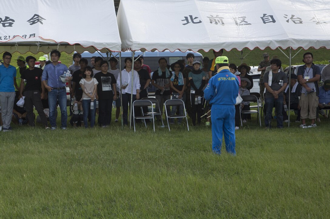 Masaharu Noguni speaks to the participants