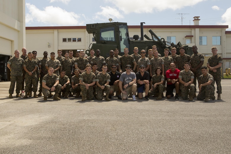 Mixed martial arts fighters and Combat Logistics Regiment 35 poses for a picture