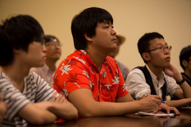 Tomoyuki Seki intently listens to a judge advocate subject matter expert