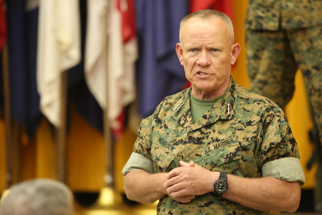 Lt. Gen. Lawrence D. Nicholson, commanding general, III Marine Expeditionary Force, addresses the audience during the III MEF Information Group re-designation ceremony on Camp Courtney, Okinawa, Japan Sept. 8, 2017. III MEF Headquarters Group was re-designated in a ceremony as III MEF Information Group, highlighting the beginning of a new era of modern Marine Corps information warfare. (U.S. Marine Corps photo by Sgt. Tiffany Edwards)