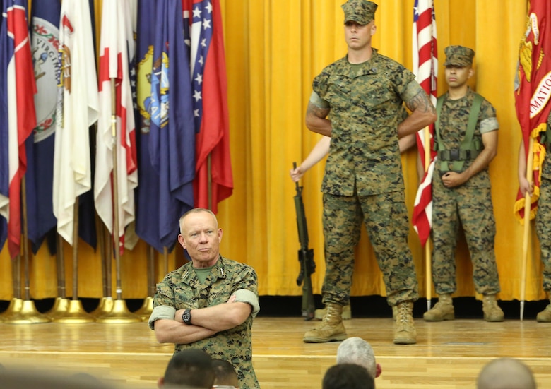 Lt. Gen. Lawrence D. Nicholson, commanding general, III Marine Expeditionary Force, addresses the crowed during the III MEF Headquarters Group re-designation ceremony at Camp Courtney, Okinawa, Japan on Sept. 8, 2017.