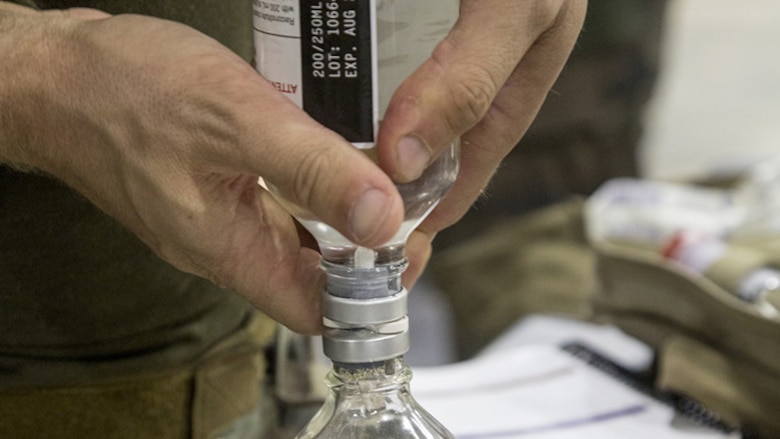 Critical Skills Operators with U.S. Marine Corps Forces, Special Operations Command reconstitute freeze-dried plasma during a Raven exercise at Camp Shelby Joint Force Training Center, Miss., May 1, 2017. CSOs go through a condensed version of FDP training to familiarize themselves with the product for use in the field.