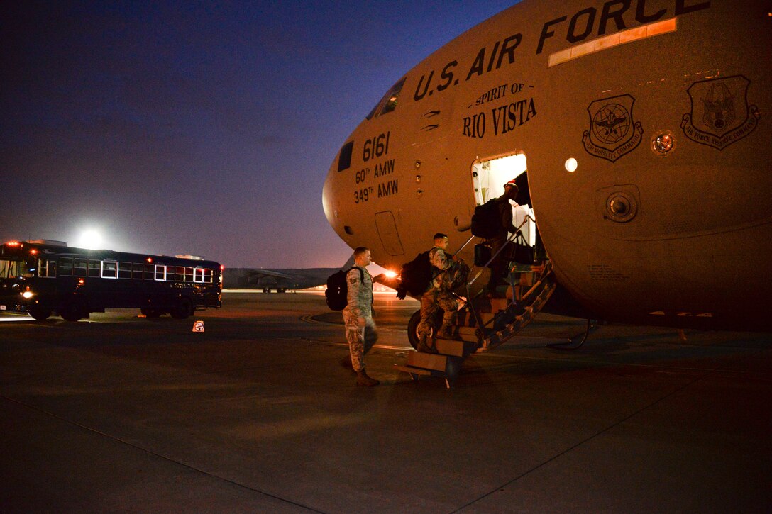 Airmen board a C-17 Globemaster III at Travis Air Force Base