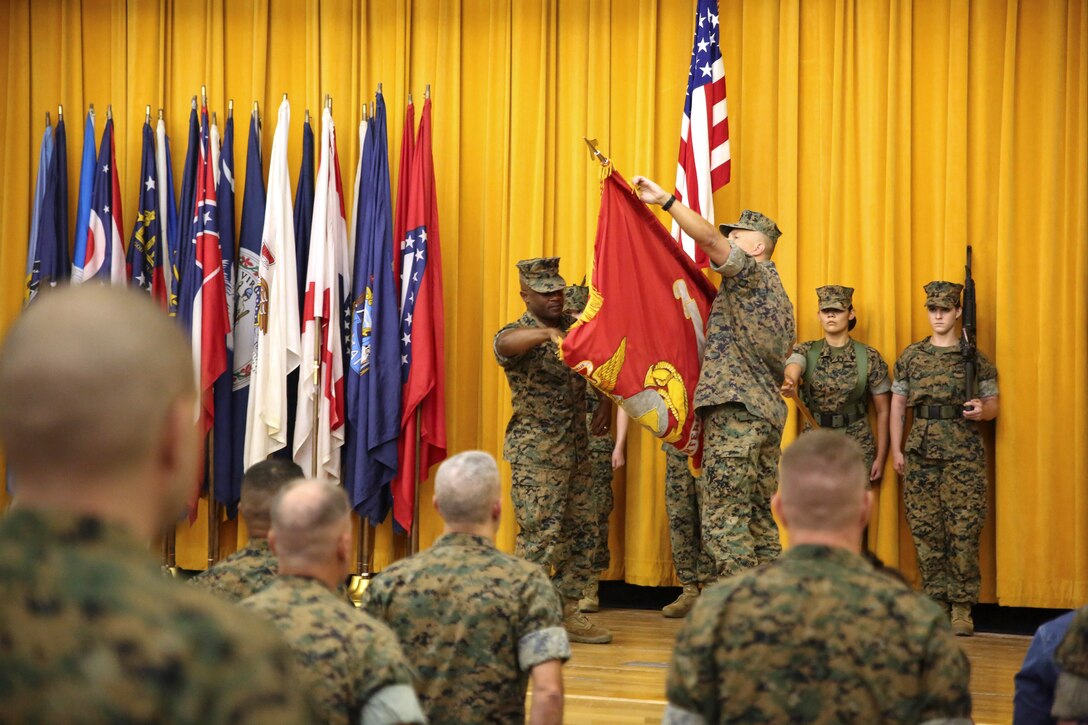 Col. Brian M. Howlett (right), commanding officer, III Marine Expeditionary Force Information Group, and Sgt. Maj. Mario P. Fields, sergeant major of III MIG, case the III MEF Headquarters Group colors during the III MIG re-designation ceremony on Camp Courtney, Okinawa, Japan Sept. 8, 2017. III MHG was re-designated in a ceremony as III MIG, highlighting the beginning of a new era of modern Marine Corps information warfare. (U.S. Marine Corps photo by Sgt. Tiffany Edwards)
