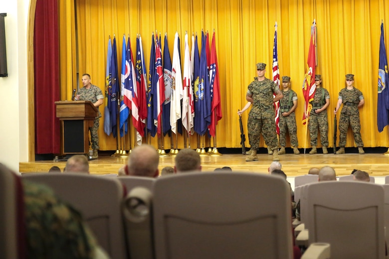 Col. Brian M. Howlett (left), commanding officer, III Marine Expeditionary Force Information Group, addresses the audience during the III MIG re-designation ceremony on Camp Courtney, Okinawa, Japan Sept. 8, 2017.