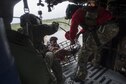 A 41st Rescue Squadron special missions aviator and a 38th Rescue Squadron pararescueman secure a basket carrying evacuees, Aug. 30, 2017, over a residence in the Houston, Texas area. The 347th Rescue Group from Moody Air Force Base, Ga. responded with its rescue aircraft and personnel in support of the Federal Emergency Management Agency after Hurricane Harvey brought flooding and destruction to parts of Texas. (U.S. Air Force photo by Tech. Sgt. Zachary Wolf)