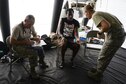 A patient receives care at a field hospital from Capt. Jerrod Taber, a physician's assistant, and Senior Airman Micah Battistoni, a medical technician, with the 149th Medical Group, Joint Base San Antonio, Texas Air National Guard, Sept. 3, 2017. The field hospital set up in the parking lot of the Baptist Hospitals of Southeast Texas as the hospital was only taking medical emergencies because of damage caused by Hurricane Harvey. (U.S. Air Force photo by Master Sgt. Joshua L. DeMotts)