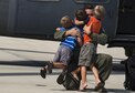 Children greet their father on the flightline after his return from supporting Hurricane Harvey Relief efforts, Sept. 3, 2017, at Moody Air Force Base, Ga. Aircrew, maintenance and support personnel from the 23rd Wing returned to Moody AFB after supporting relief efforts in the aftermath of Hurricane Harvey in Texas. (U.S. Air Force photo by Andrea Jenkins)
