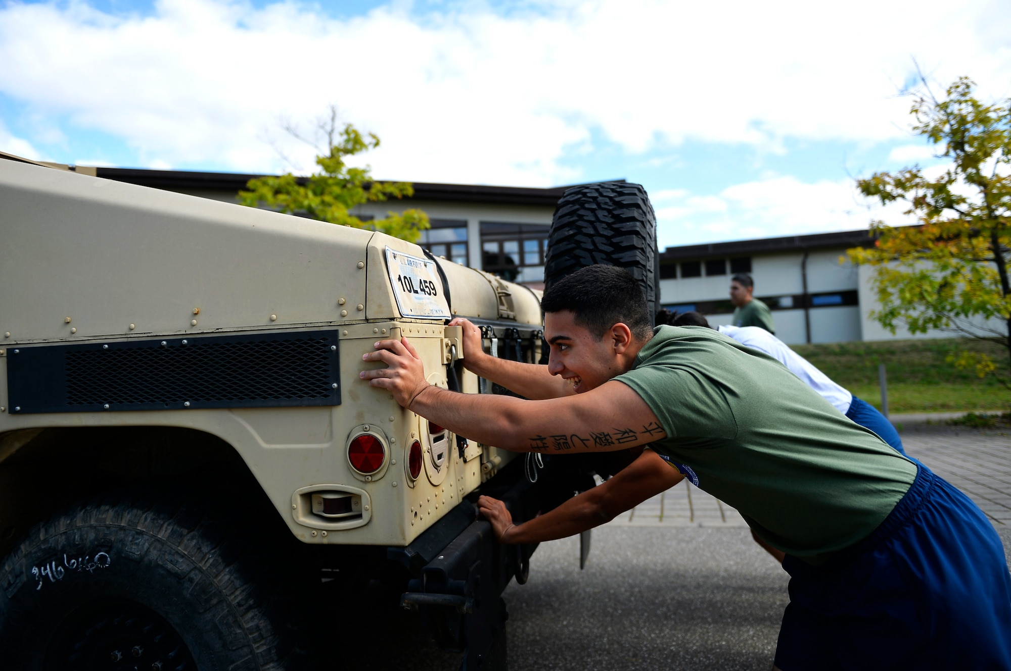 U.S. Airmen assigned to the 86th Airlift Wing push a Humvee during the annual Commander’s Challenge resiliency day on Ramstein Air Base, Germany, Sept. 6 2017. Air Force Instruction 90-506 requires Air Force units to conduct two resiliency days each year. (U.S. Air Force photo by Airman 1st Class Joshua Magbanua)