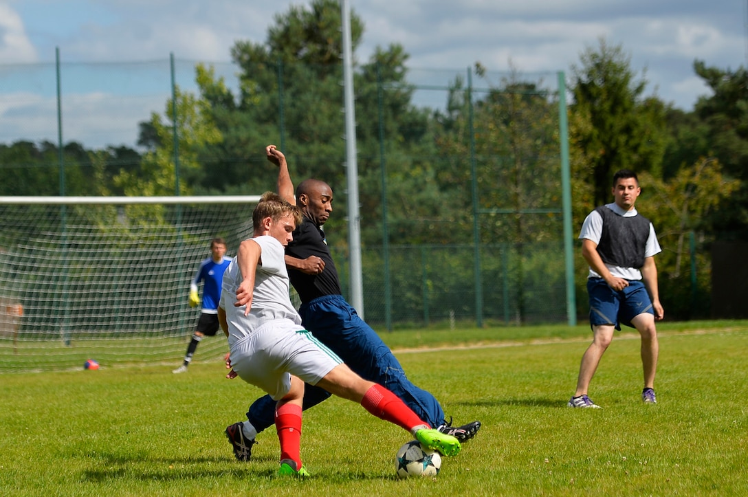 U.S. Airmen assigned to the 86th Airlift Wing play soccer during the annual Commander’s Challenge resiliency day, Sept. 6, 2017. The event promoted camaraderie and team-building through physical activity and social interaction. (U.S. Air Force photo by Airman 1st Class Joshua Magbanua)