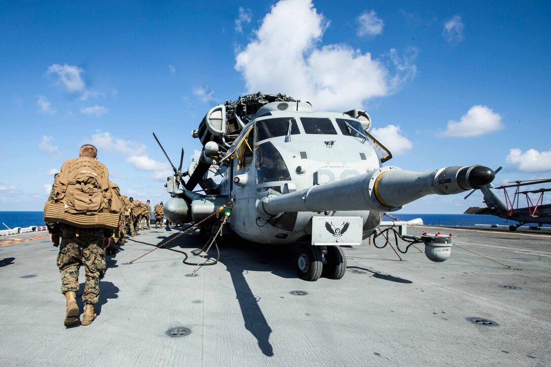 U.S. Marines with Battalion Landing Team 2nd Battalion, 6th Marine Regiment, 26th Marine Expeditionary Unit (MEU), conduct preliminary boarding procedures on a CH-53E Super Stallion helicopter with Marine Medium Tiltrotor Squadron 162 (Reinforced), 26th MEU, aboard amphibious assault ship USS Kearsarge (LHD 3) in the Atlantic Ocean, Sept. 7, 2017. The preparations ensure the 26th MEU is ready to respond to any requests to bolster Northern Command's support of FEMA's assistance to federal, state and local authorities' ongoing relief efforts in the aftermath of Hurricane Irma. (U.S. Marine Corps photo by Lance Cpl. Tojyea G. Matally)