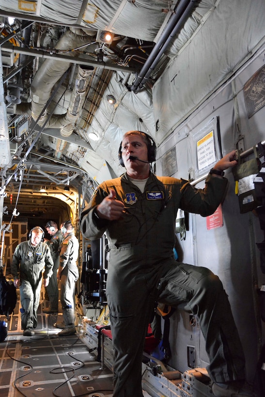 North Carolina Air National Guard Maj. Phillip Angelo prepares for takeoff aboard a C-130 Hercules aircraft.