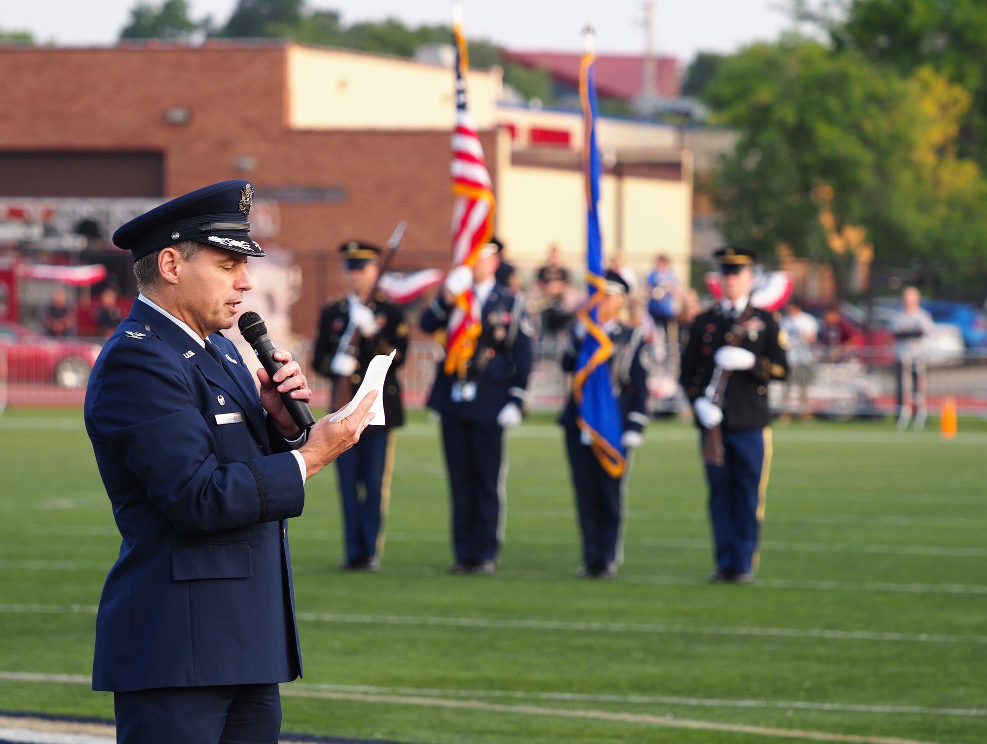 Col. Tony Polashek, 934th Airlift Wing commander, provides opening remarks at Concordia College's Night of Heroes event before the opening kickoff of their 2017 football season. (Air Force Photo/Paul Zadach)