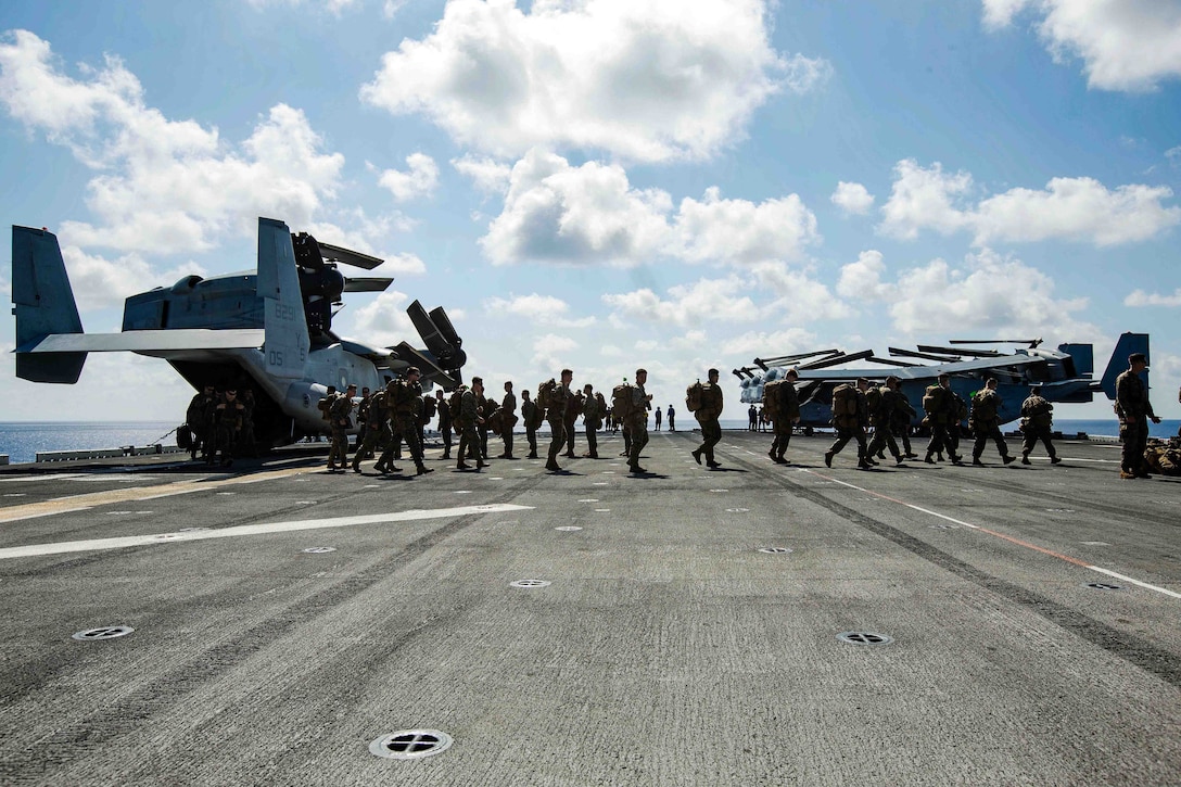 U.S. Marines with Battalion Landing Team 2nd Battalion, 6th Marine Regiment, 26th Marine Expeditionary Unit (MEU), conduct preliminary boarding procedures on a CH-53E Super Stallion helicopter and MV-22B Osprey aircraft with Marine Medium Tiltrotor Squadron 162 (Reinforced), 26th MEU, aboard the amphibious assault ship USS Kearsarge (LHD 3) in the Atlantic Ocean, Sept. 7, 2017. The preparations ensure the 26th MEU is ready to respond to any requests to bolster Northern Command's support of FEMA's assistance to federal, state and local authorities' ongoing relief efforts in the aftermath of Hurricane Irma.