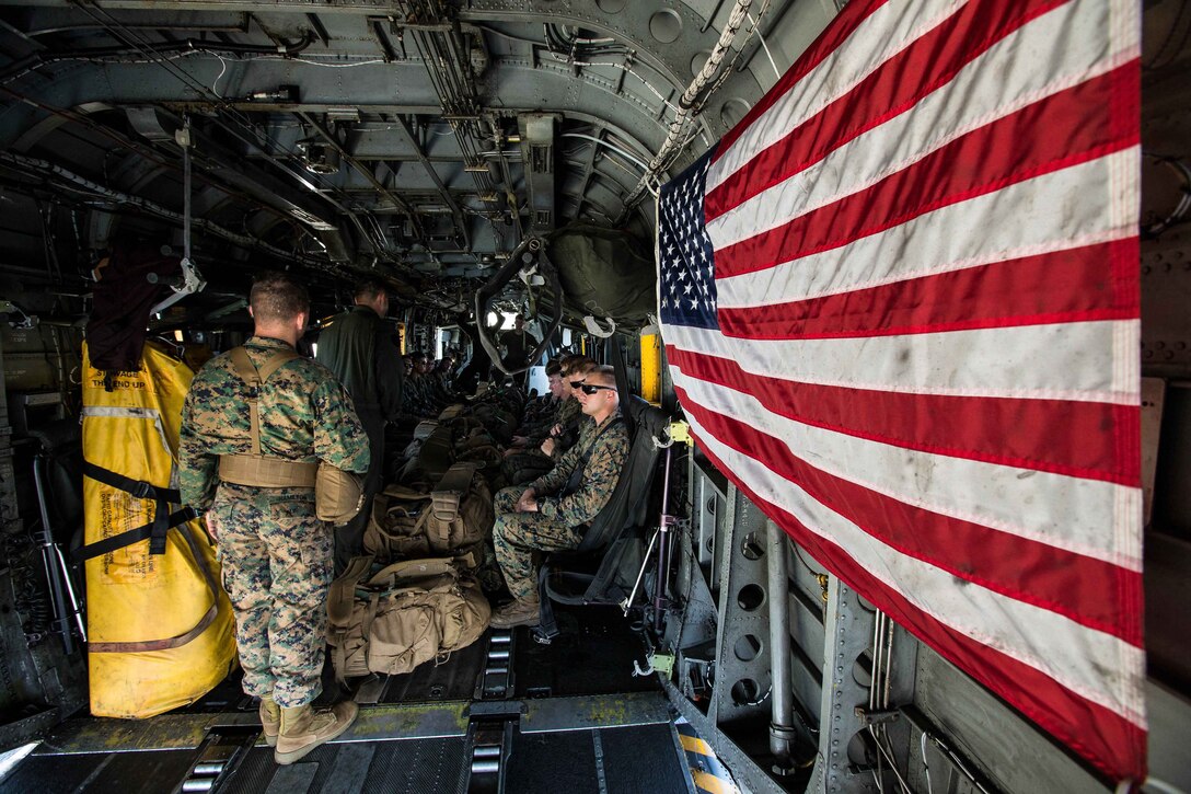 U.S. Marines with Battalion Landing Team 2nd Battalion, 6th Marine Regiment, 26th Marine Expeditionary Unit (MEU), conduct preliminary boarding procedures on a CH-53E Super Stallion helicopter with Marine Medium Tiltrotor Squadron 162 (Reinforced), 26th MEU, aboard amphibious assault ship USS Kearsarge (LHD 3) in the Atlantic Ocean, Sept. 7, 2017. The preparations ensure the 26th MEU is ready to respond to any requests to bolster Northern Command's support of FEMA's assistance to federal, state and local authorities' ongoing relief efforts in the aftermath of Hurricane Irma. (U.S. Marine Corps photo by Lance Cpl. Tojyea G. Matally)