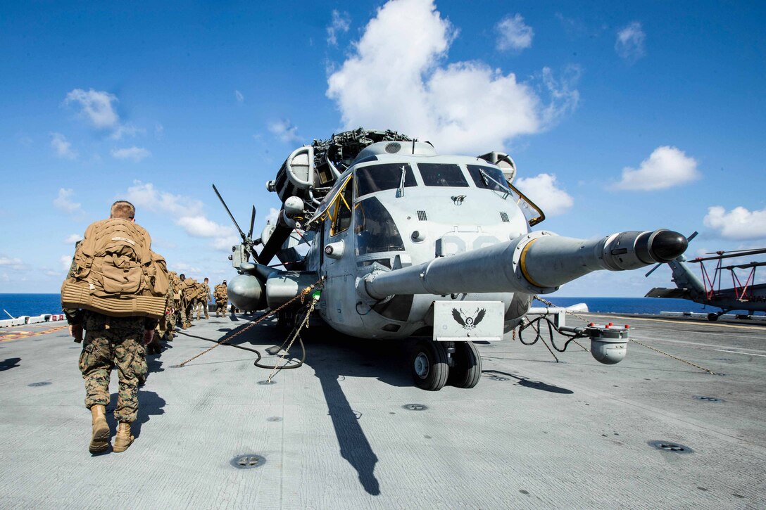 U.S. Marines with Battalion Landing Team 2nd Battalion, 6th Marine Regiment, 26th Marine Expeditionary Unit (MEU), conduct preliminary boarding procedures on a CH-53E Super Stallion helicopter and MV-22B Osprey aircraft with Marine Medium Tiltrotor Squadron 162 (Reinforced), 26th MEU, aboard the amphibious assault ship USS Kearsarge (LHD 3) in the Atlantic Ocean, Sept. 7, 2017. The preparations ensure the 26th MEU is ready to respond to any requests to bolster Northern Command's support of FEMA's assistance to federal, state and local authorities' ongoing relief efforts in the aftermath of Hurricane Irma.