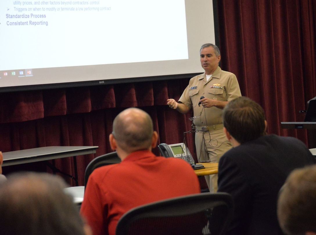 Navy Cmdr. Walter Ludwig, representing the Office of the Assistant Secretary of Defense for Energy, Installations and Environment, addresses Energy Savings Performance Contracting Measurement and Verification Workshop attendees Aug. 29.