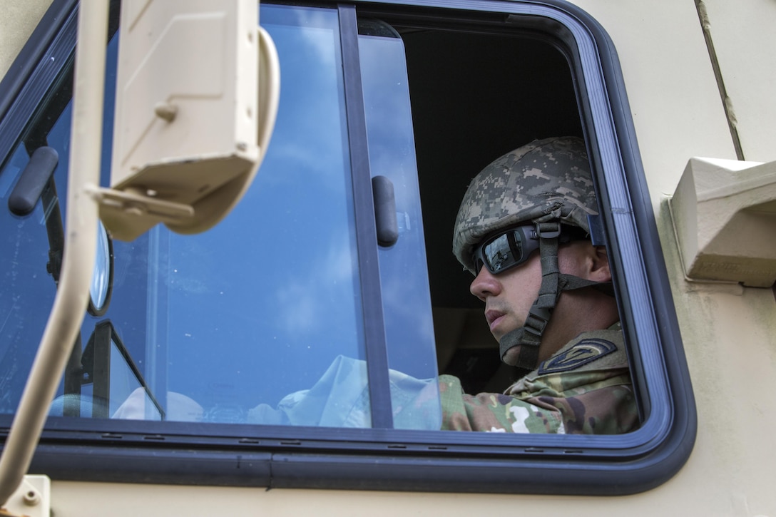 A New Jersey Army National Guardsman assigned to the 253rd Transportation Company prepares to depart from Cape May Courthouse, N.J.