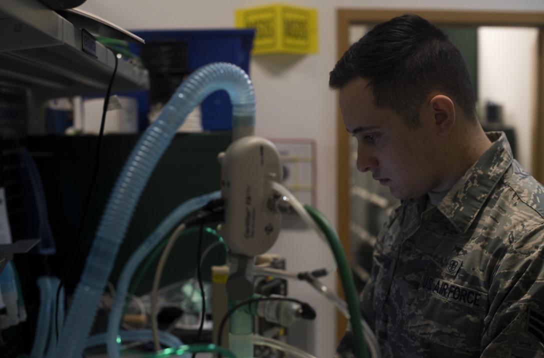 U.S. Air Force Senior Airman Dustin Johnson, 86th Medical Support Squadron biomedical maintenance technician, calibrates a ventilator to ensure it is in perfect working condition on Ramstein Air Base, Germany, Sept. 7, 2017. Johnson and his fellow Airmen service all equipment that is used to support aeromedical evacuation patients. (U.S. Air Force photo by Senior Airman Tryphena Mayhugh)