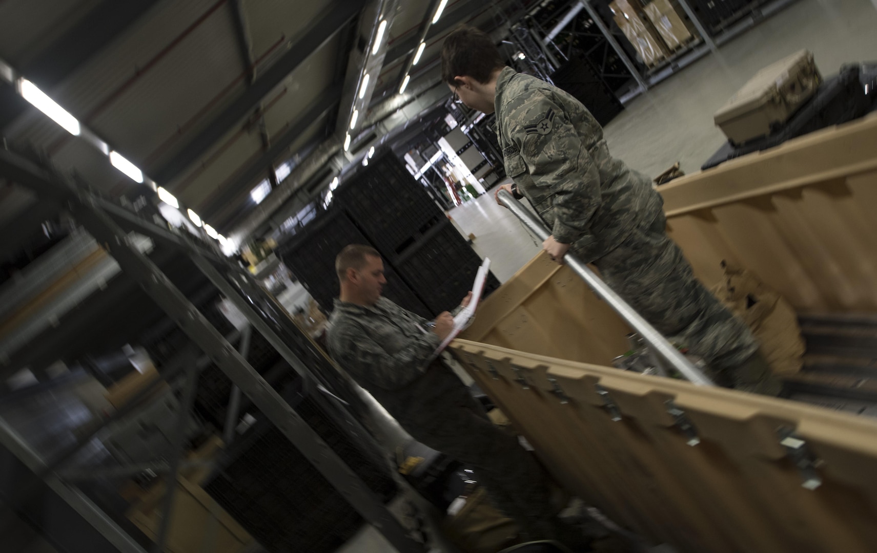 U.S. Air Force Staff Sgt. Christopher Ryde, 86th Medical Support Squadron war reserve material supervisor, and U.S. Air Force Airman 1st Class Breanna Jannarone, 86th MDSS medical logistician, take inventory of medical equipment on Ramstein Air Base, Germany, Sept. 7, 2017. Ryde, Jannarone, and their coworkers conduct a full inventory of every piece of medical supplies and equipment stored in the 86th MDSS’ three warehouses every two years. (U.S. Air Force photo by Senior Airman Tryphena Mayhugh)