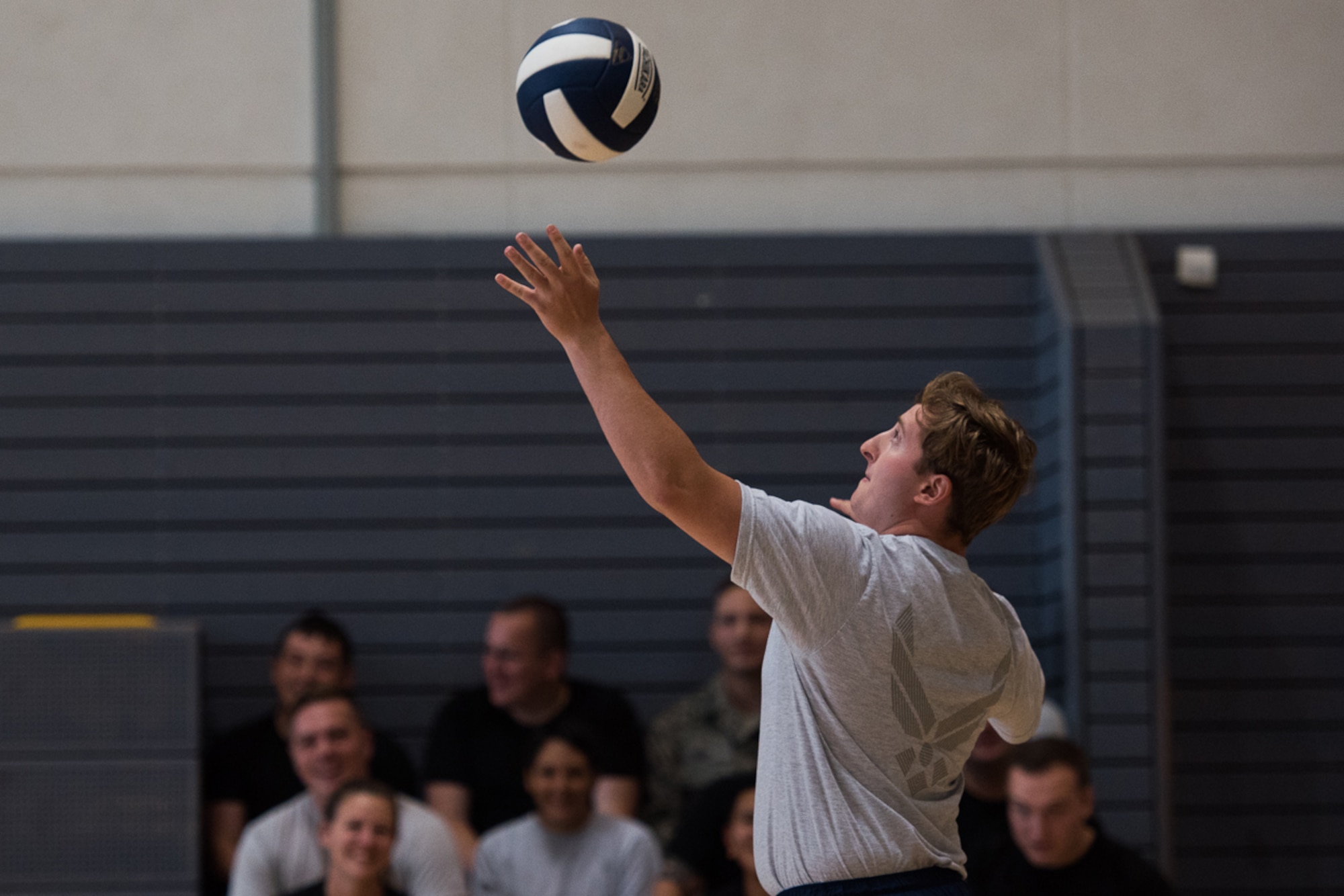 A U.S. Airman assigned to the 86th Airlift Wing, serves a volleyball during the Commander's Challenge on Ramstein Air Base, Germany. Sept. 6, 2017. Airmen from all over the wing competed in sports as a part of the annual resiliency day. (U.S. Air Force photo by Airman 1st Class Devin M. Rumbaugh)
