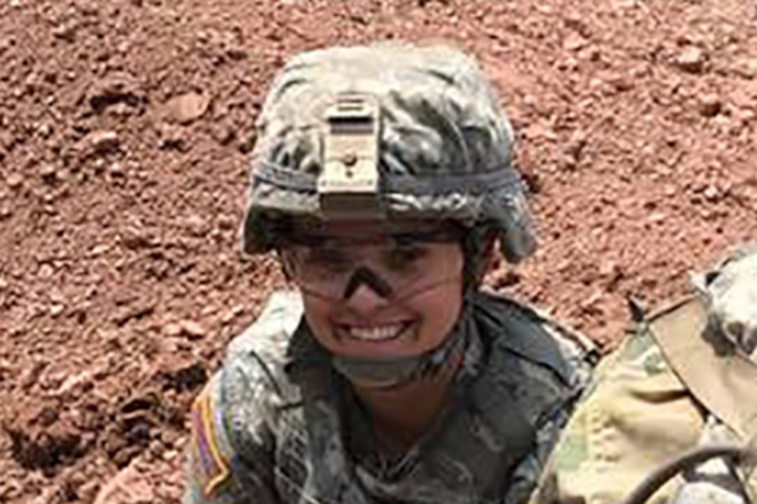 A soldier poses for a photo during training.