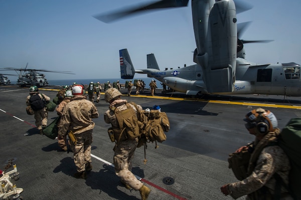 Marines assigned to the 15th Marine Expeditionary Unit aboard the amphibious assault ship USS America (LHA 6) board an MV-22 Osprey assigned to Marine Medium Tiltrotor Squadron (VMM) 161 (Reinforced) for a scheduled departure to Djibouti in support of exercise Alligator Dagger 2017. Alligator Dagger is a dedicated, unilateral combat rehearsal led by Naval Amphibious Force, Task Force 51/5th Marine Expeditionary Brigade, in which combined Navy and Marine Corps units of the America Amphibious Ready Group and embarked 15th Marine Expeditionary Unit are to practice, rehearse and exercise integrated capabilities that are available to U.S. Central Command both afloat and ashore. (U.S. Navy photo by Mass Communication Specialist Seaman Apprentice Chad Swysgood/Released)