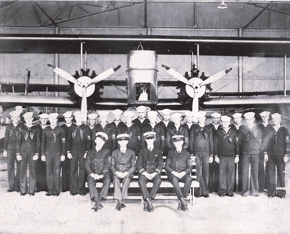 IMAGE: 8x10 negative
Group photo of 26 aviation personnel, 4 officers, 22 pilots/sailors in front of a twin engine plane