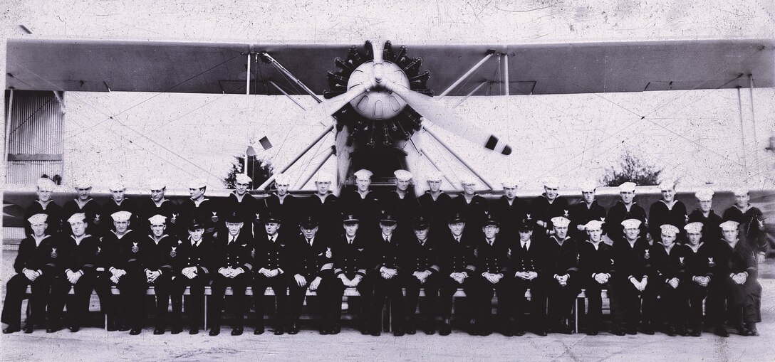 IMAGE: Fall 1936
Naval air detail, NPG, Plane TG-2 Seated: L to R: Beneice, Renn, Paulson,
Poston, Edwards, Counts, Phinney, Spahr, LCDR Braun, Lt. Ellis, Wombles, Marvelle, White, Sager,
Flannigan, Peters, Curtis, McKissick, Miller & Ritchie. Standing: Lto R: Sherley, Saunders, Alcorn,
Gibbs, Sullivan, Barnett, Carter, Kemper, Barren, Setterberg, Cole, Smith, Julian, Wynn, Humphrey,
Grace, Lone and Kivell.