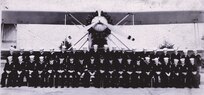IMAGE: Fall 1936
Naval air detail, NPG, Plane TG-2 Seated: L to R: Beneice, Renn, Paulson,
Poston, Edwards, Counts, Phinney, Spahr, LCDR Braun, Lt. Ellis, Wombles, Marvelle, White, Sager,
Flannigan, Peters, Curtis, McKissick, Miller & Ritchie. Standing: Lto R: Sherley, Saunders, Alcorn,
Gibbs, Sullivan, Barnett, Carter, Kemper, Barren, Setterberg, Cole, Smith, Julian, Wynn, Humphrey,
Grace, Lone and Kivell.