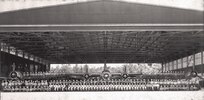 IMAGE: 1940s? Early '42?
Group Photo in Hangar-on eft wing of plane #13-15 airmen, on right wing of
plande 92-16 airmen, sitting on ground to left-13 airmen, seated-41, women standing in middle row-31,
last row-76, total 203 personnel. Planes visible in Photo: Twin prop-#34, Single props-#13, #92, #91,
#16
