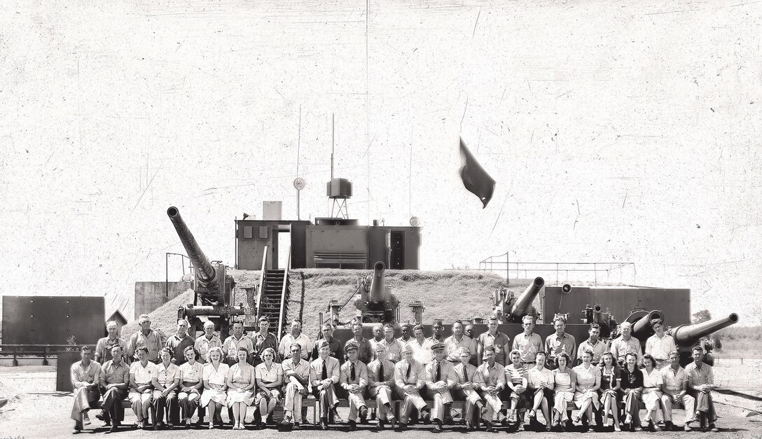 IMAGE: 4 Aug 1945
ORDNANCE HISTORY: Plate Fuze Battery Personnel, Front Row L-R: E.B. Lewis, W. Cleek, C. Shook,
M. Rose, M. Baird, B. Wegner, N. Atkins, N. Wall, J. Owens, Ens. F.M. Perkins, USNR; Lt. (jg) V.
Philipchuk, USNR, Comdr. GT. Atkins, USN, Comdr. G. K. Williams, USN, Lt. P.A. Krentel, USNR; Lt
(jg) J.H. Roseboom, USNR, Grayson Elliott, H. Legg, E. Pulliam, D. THornhill, A. Wesner, E. Armstrong,
N. Sperance, D. Stone, L. Morgan, F. Staples. Standing L-R: W. Brandy, G. McKenny, J. Daffan, H
Green, J. White, M. Henderson, W. Marshall, J. Jenkins, G. Clarke, A. Brent, T. Newton, I. Davis, G.
Alford, T. Stewart, J. Nash, J. Parker, L. Newton, H. Crowley, R. Rice, E. Brown, J. Bellomy, T. Reeves,
Following personnel not in picture: Lt. L.E. Sizemore, USNR; W. Rose, O. Henderson, C. Dodson, A.
Smoot, H. Ratcliffe, H. Trott, C. Gallahan, N. Naves, P. Luck, J. Coe, W. Robinson