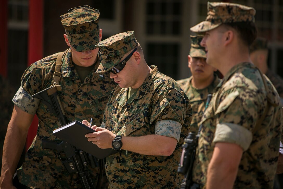 U.S. Marines with the 26th Marine Expeditionary Unit (MEU), provide accountability reports for their respective units to Sgt. Andrew J. Getman, center, an administrative specialist with the 26th MEU, during a departure to embark aboard the amphibious assault ship USS Iwo Jima at Marine Corps Base Camp Lejeune, N.C., Sept. 7, 2017. Approximately 300 Marines with the 26th MEU embarked on the USS Iwo Jima in preparation to ensure the unit is ready to respond to any requests to bolster Northern Command’s support of FEMA’s assistance to federal, state and local authorities’ ongoing relief efforts in the aftermath of Hurricane Irma. (U.S. Marine Corps photo by Staff Sgt. Dengrier M. Baez)