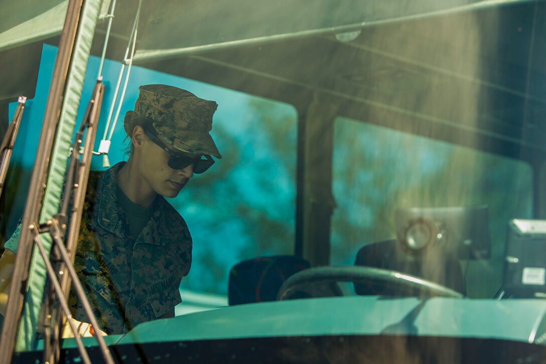 U.S. Marine Corps 1st Lt. Kayla M. Sharp, the officer in charge of Law Enforcement Detachment, 26th Marine Expeditionary Unit (MEU), boards a bus during a departure to embark aboard the amphibious assault ship USS Iwo Jima at Marine Corps Base Camp Lejeune, N.C., Sept. 7, 2017. Approximately 300 Marines with the 26th MEU embarked on the USS Iwo Jima in preparation to ensure the unit is ready to respond to any requests to bolster Northern Command’s support of FEMA’s assistance to federal, state and local authorities’ ongoing relief efforts in the aftermath of Hurricane Irma. (U.S. Marine Corps photo by Staff Sgt. Dengrier M. Baez)