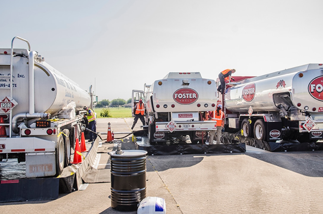 Three fuel trucks being filled at Fort Hood Army Airfield, Fort Hood, Texas.