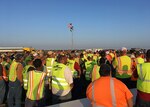 Foster Fuels employees gather before heading out on missions in support of FEMA at Fort Hood Army Airfield, Fort Hood, Texas.