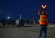 A Dobbins airfield manager guides in a C-130 as it taxis on the flightline at Dobbins Air Reserve Base, Ga. Sept. 6, 2017. The aircraft carried civilian and contract Department of Defense personnel who were evacuated from the Caribbean. (U.S. Air Force photo/Don Peek)