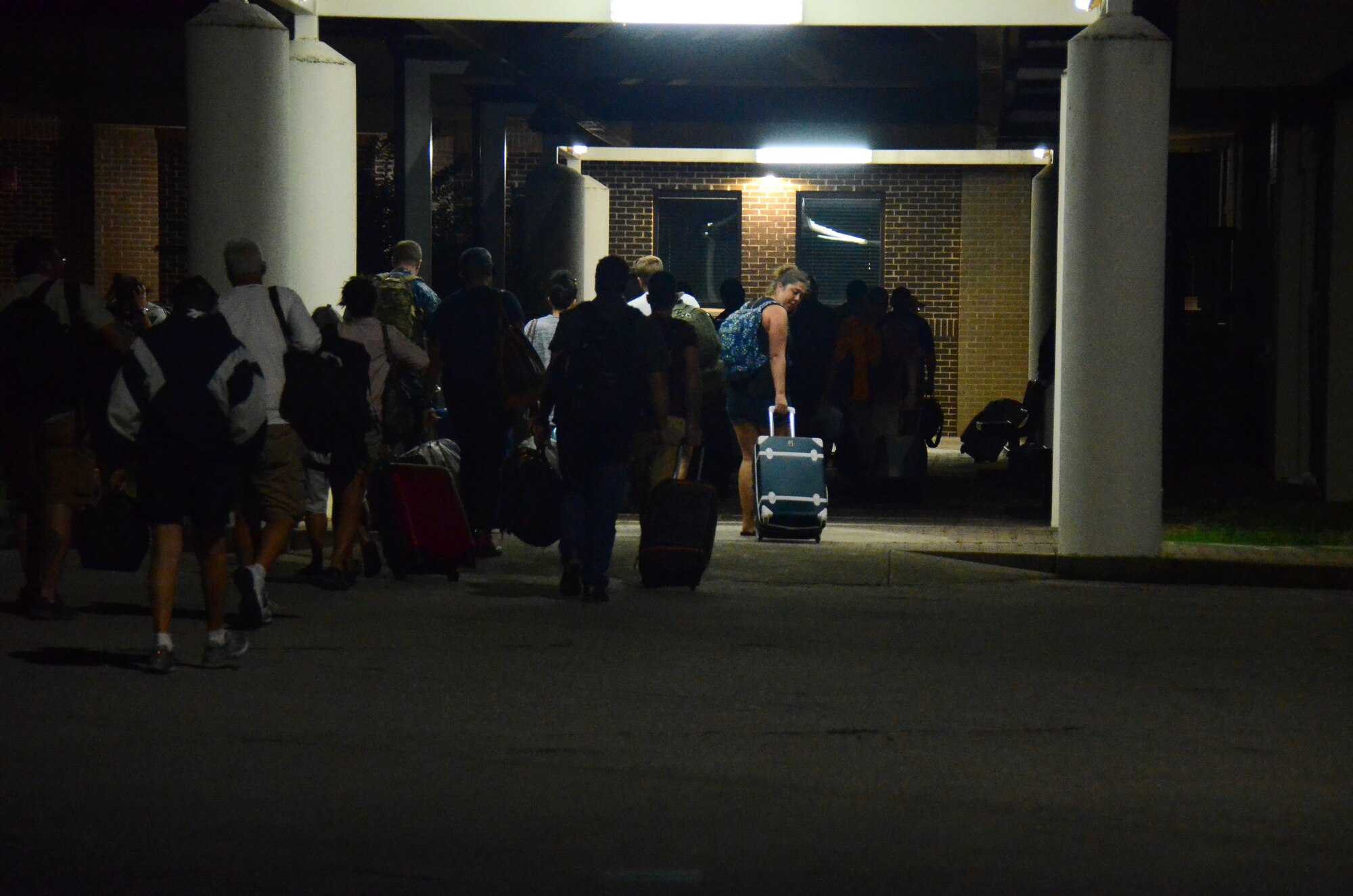 Evacuees exit the flightline at Dobbins Air Reserve Base, Ga. Sept. 6, 2017. Once they exited, they were accounted for and then taken by bus to temporary lodging for the duration of Hurricane Irma. (U.S. Air Force photo/Don Peek)