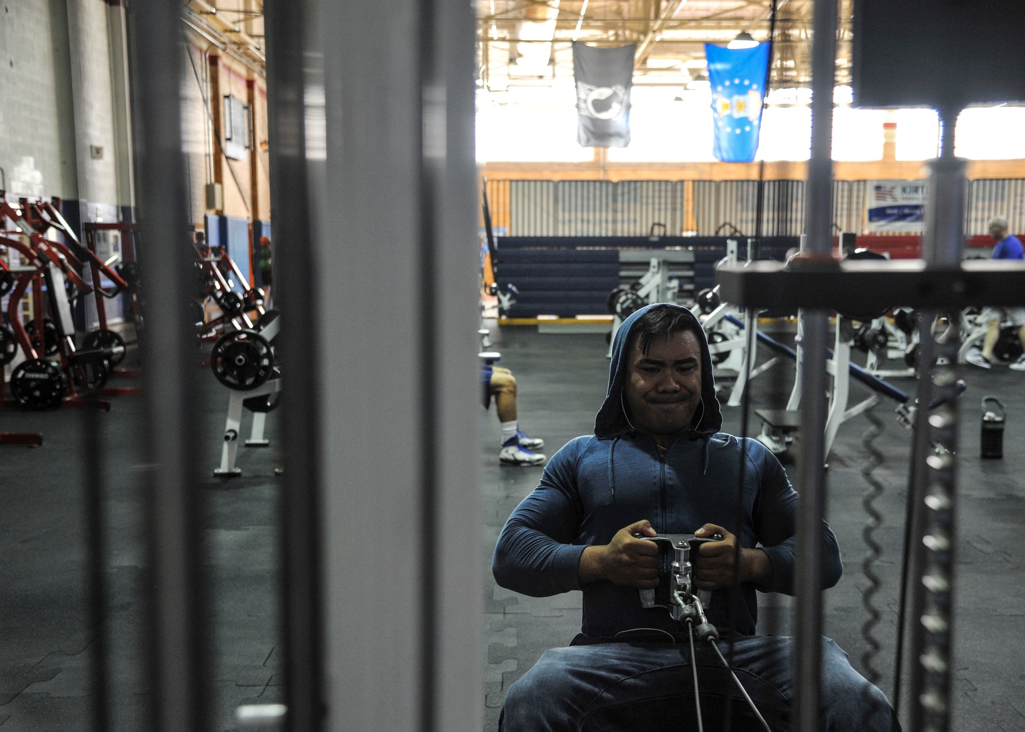 Senior Airman Neal John Sanchez, Security Forces Squadron response force leader gets a workout in during the ribbon-cutting ceremony at the East Side Fitness Center on Kirtland Air Force Base, New Mexico Aug. 30. The renovations were made to accommodate customers’ wants and needs. When discussing what changes were going to be made, it was important to find a way to also fully incorporate the four pillars of comprehensive Airmen fitness. (U.S. Air Force Photo/Airman First Class Alexandria