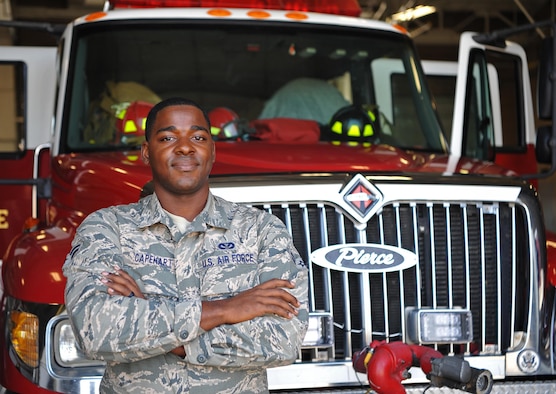 Airman 1st Class Christian Capehart, 9th Civil Engineer Squadron firefighter, poses for a photo.