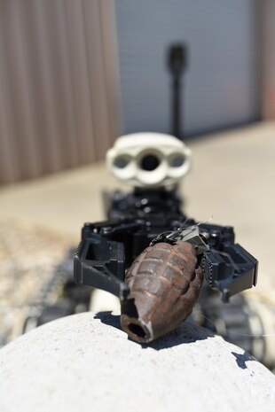 A Micro Tactical Ground Robot captures a mock grenade during EOD training at Beale Air Force Base, California, July 28, 2017. The MTGR is equipped with 360 degree video, night vision and is controlled wirelessly.