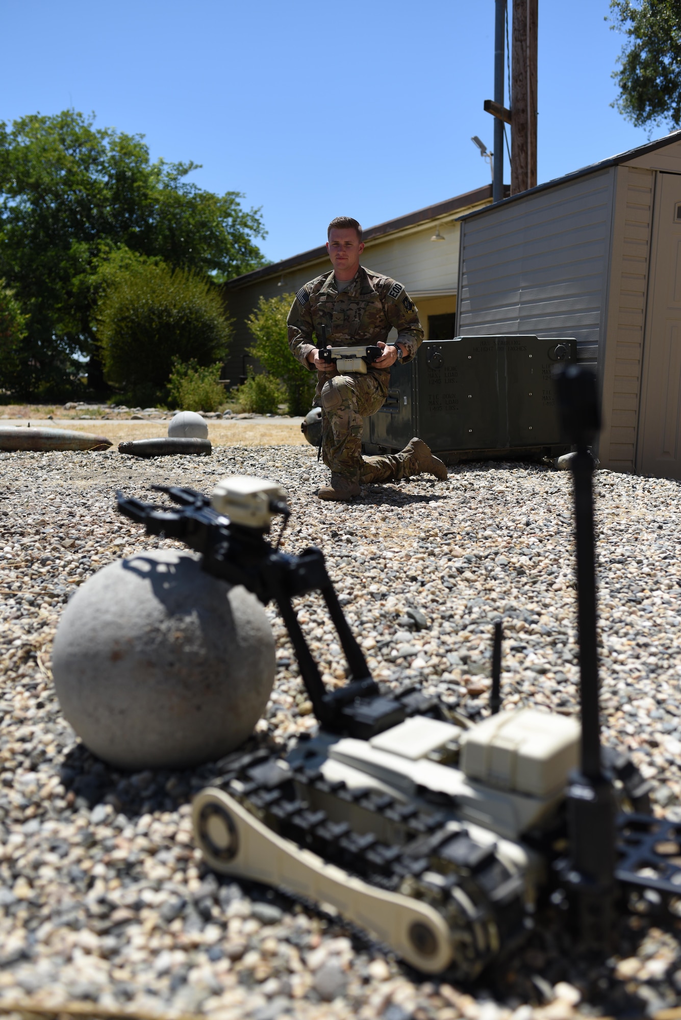 Senior Airman Jared Basham, 9th Civil Engineer Squadron ordnance disposal technician, controls a Micro Tactical Ground Robot during familiarize training at Beale Air Force Base, California, July 28, 2017. The MTGR is a man portable robot meant to be able to transverse any terrain.
