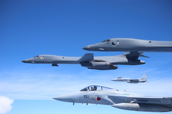 Two U.S. Air Force B-1B Lancers fly a bilateral mission with two Koku Jieitai (Japan Air Self-Defense Force) F-15s in the vicinity of the East China Sea, Sept. 9, 2017. Following the end of the operation, one B-1B split off to Misawa Air Base, Japan, to be a static display for the Misawa Air Festival, while the other B-1B returned to Andersen Air Force Base, Guam. The purpose of bilateral training is to foster increased interoperability between Japan and U.S. aircraft. Participating in bilateral training enables the operational units to improve their combined capabilities and tactical skills, while also building bilateral confidence and strong working relationships. (Courtesy Photo)