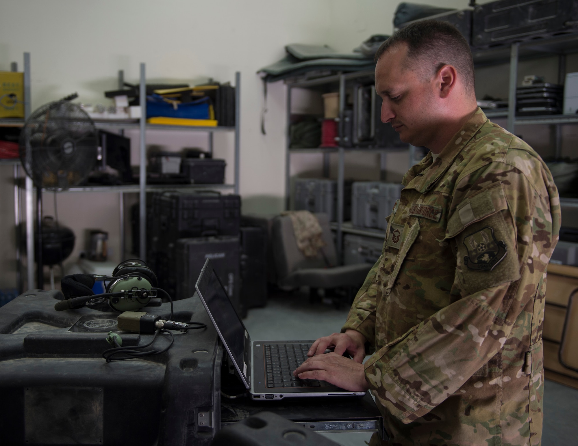 The Airborne Communication non-commissioned officer in charge with the 379th Expeditionary Communication Squadron performs a system check on equipment at Al Udeid Air Base, Qatar, July 14, 2017.