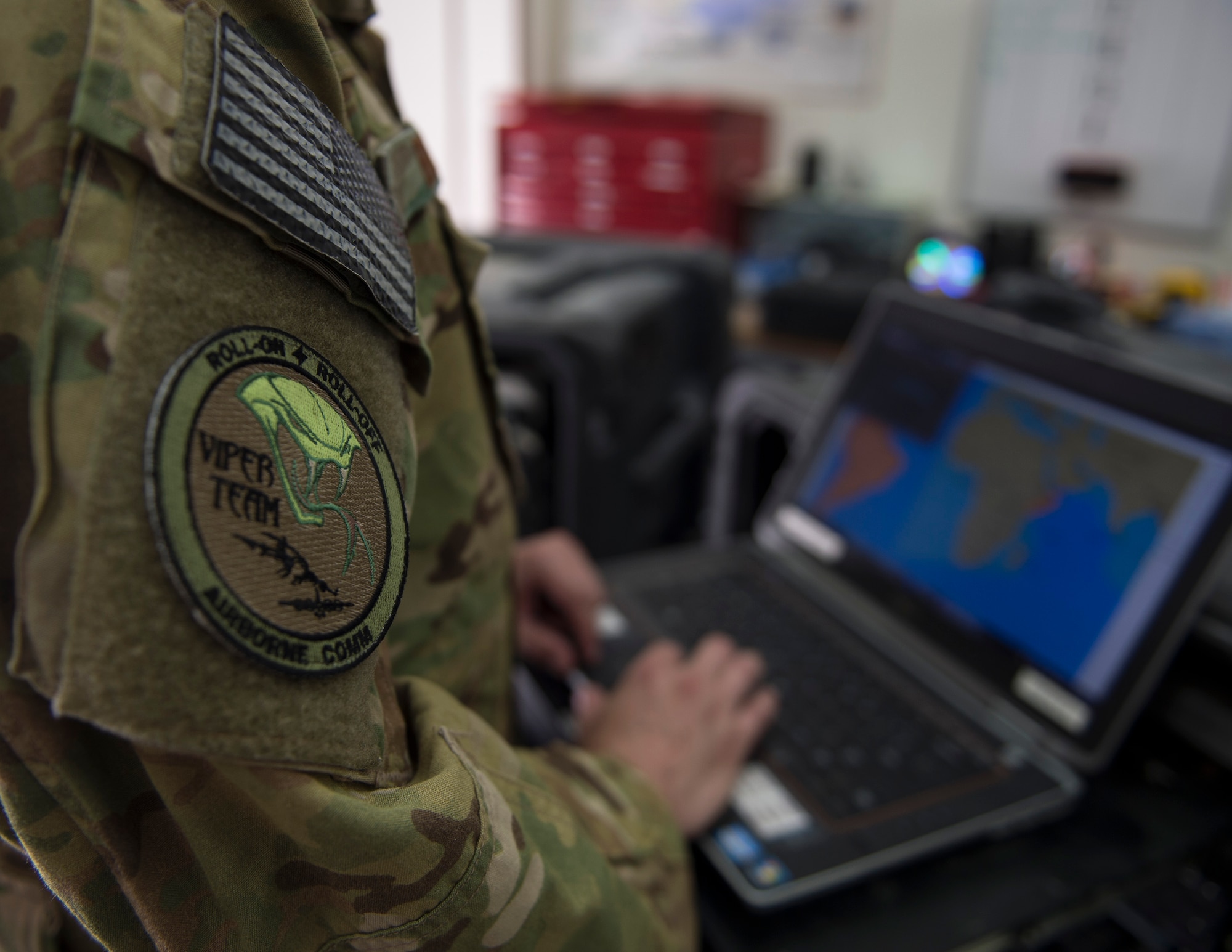 The Airborne Communication non-commissioned officer in charge with the 379th Expeditionary Communication Squadron performs a system check on equipment at Al Udeid Air Base, Qatar, July 14, 2017.