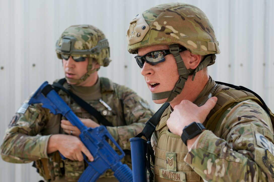 U.S. Air Force Tech. Sgt. Timothy Davidson, foreground, and Senior Airman Stephen Gillum, patrolmen assigned to the 379th Expeditionary Security Forces Squadron, take part in an active shooter exercise conducted at Al Udeid Air Base, Qatar, Aug. 31, 2017.