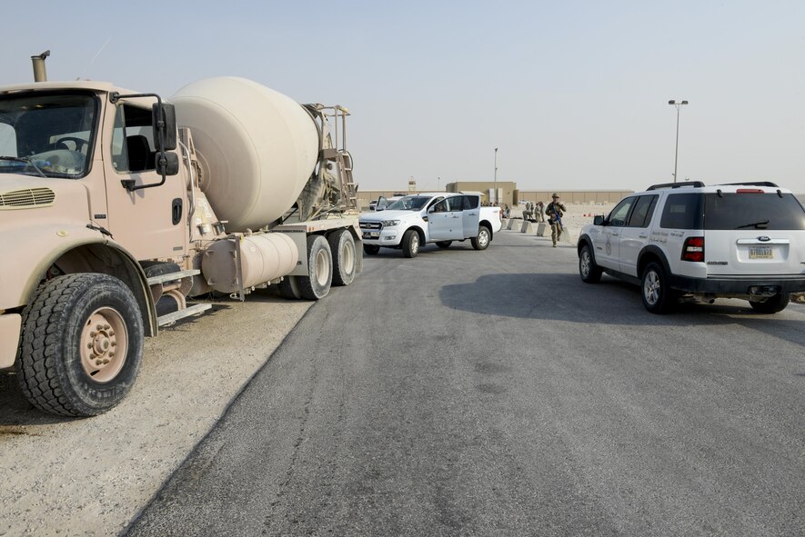 A U.S. Air Force security forces member, assigned to the 379th Expeditionary Security Forces Squadron, walks through a simulated crime scene toward a security forces vehicle during an active shooter exercise conducted at Al Udeid Air Base, Qatar, Aug. 31, 2017.
