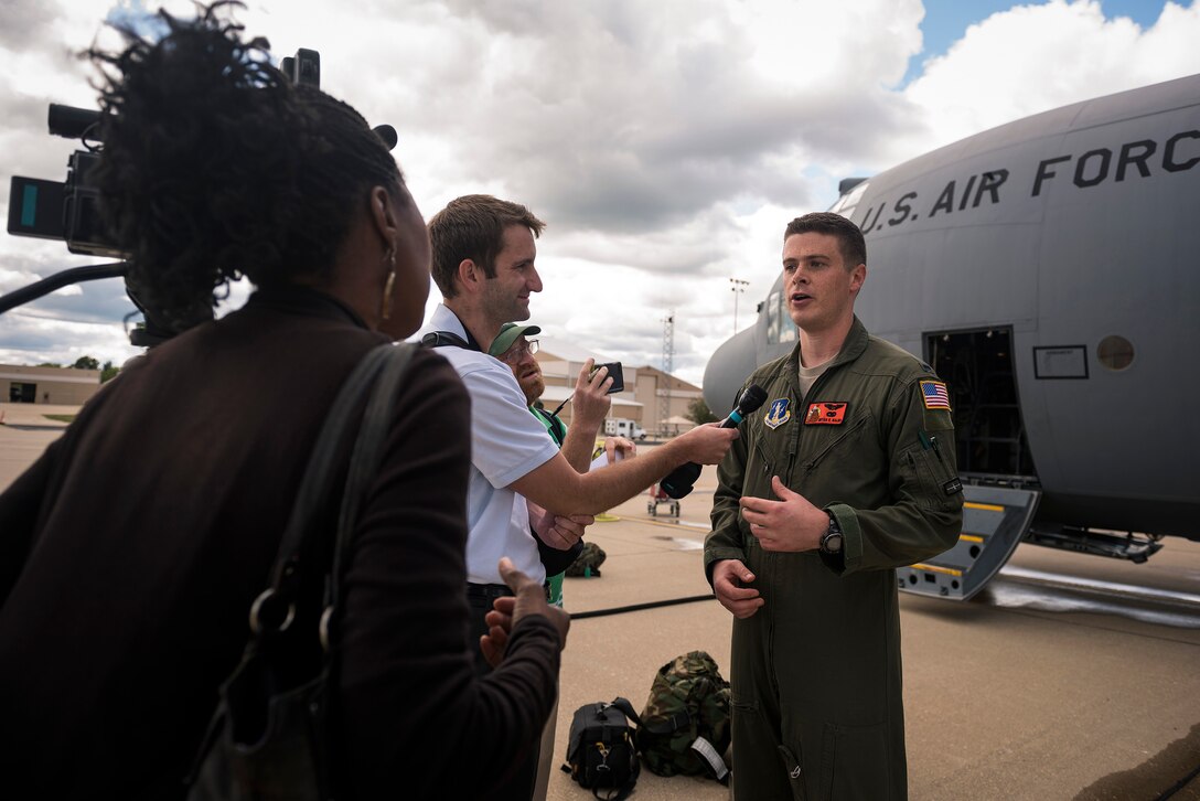 U.S. Air Force 1st Lt. Bryan Walsh, a C-130H Hercules pilot with the 169th Airlift Squadron, Illinois Air National Guard, speaks with local media after returning to Peoria, Ill., Sept. 6, 2017. Walsh and six Peoria Airmen returned from Texas where they supported Hurricane Harvey relief and recovery efforts with their C-130H Hercules. (U.S. Air National Guard photo by Tech. Sgt. Lealan Buehrer)