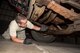 Senior Airman Benjamin Gustin, an air transportation specialist with the 27th Aerial Port on Minneapolis-St. Paul Air Reserve Station, Minn. inspects for leaks on a vehicle being shipped to Nicaragua at Volk Field, Wis. Sep. 5, 2017. A loss of fluid at a rate which is readily detected can prevent vehicles from being transported on military aircraft.   (U.S. Air Force photo by Master Sgt. Eric Amidon/ Released)