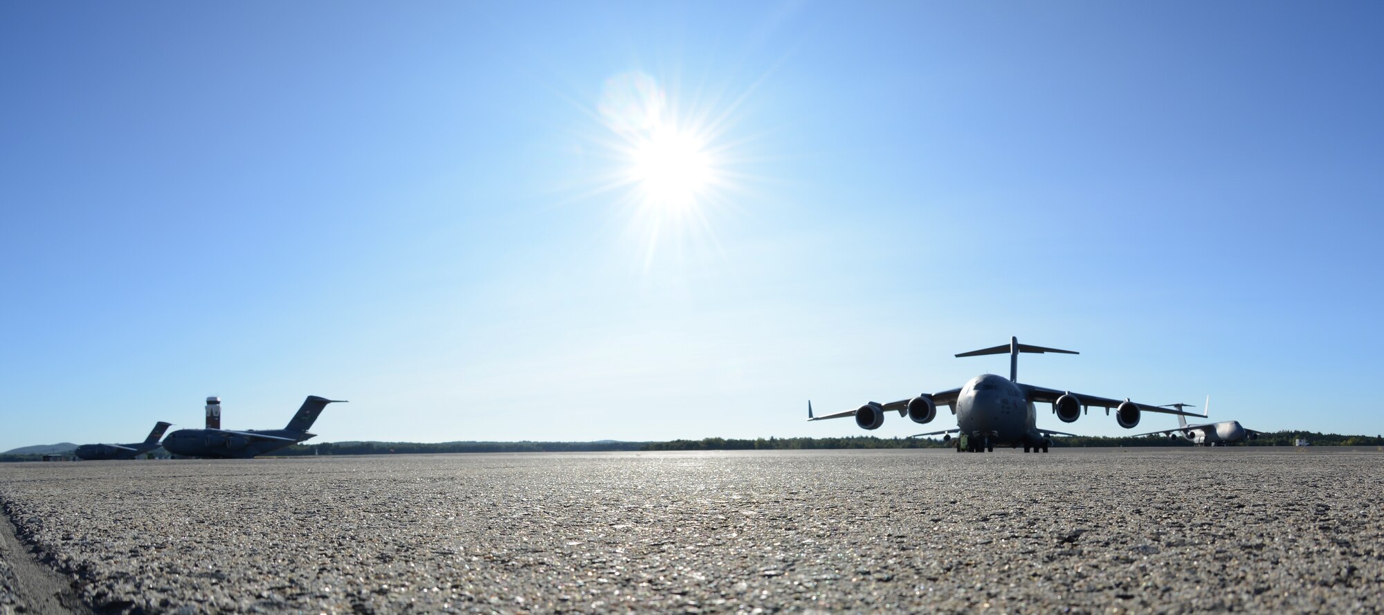 Three C-17 Globemaster IIIs sit on the flightline September 9, 2017, at Westover Air Reserve Base, Mass.  These three C-17s from Joint Base McGuire-Dix-Lakehurst, New Jersey, Joint Base Lewis-McChord, Washington and March ARB, California, are to be loaded with Federal Emergency Management Agency supplies by Westover ARB Reserve Citizen Airmen to assist those impacted by Hurricane Irma. (U.S. Air Force photo by Airman Hanna N. Smith)
